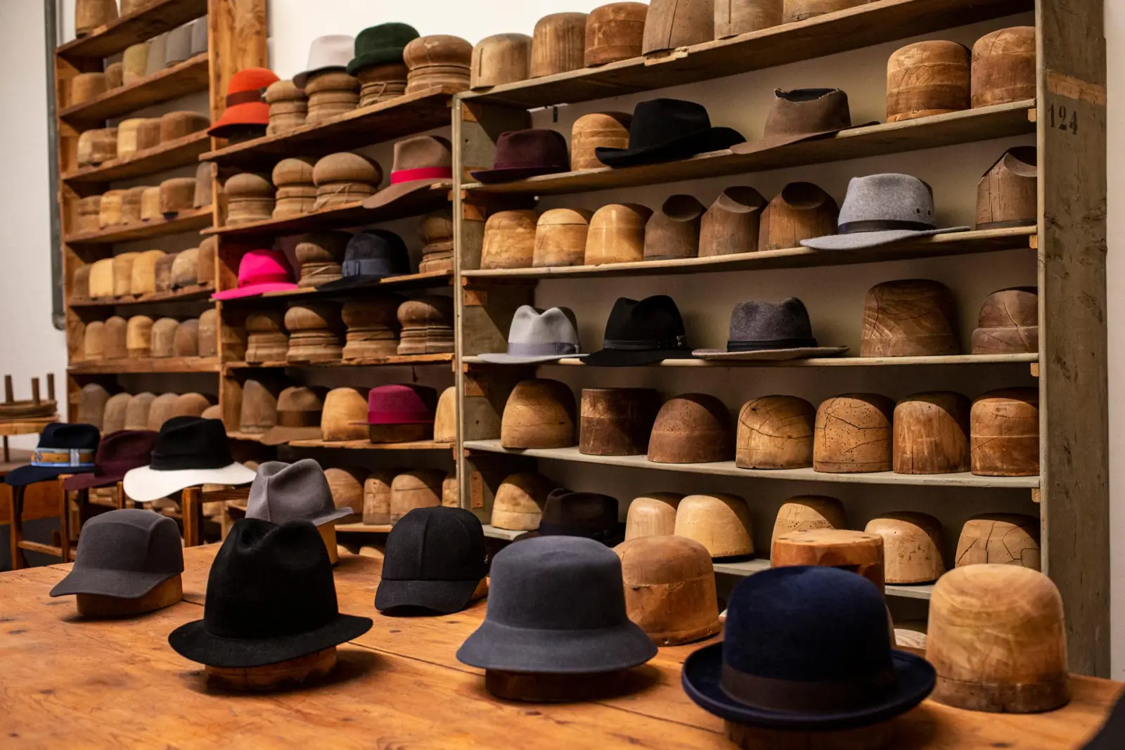 Coloured felt hats on the shelves