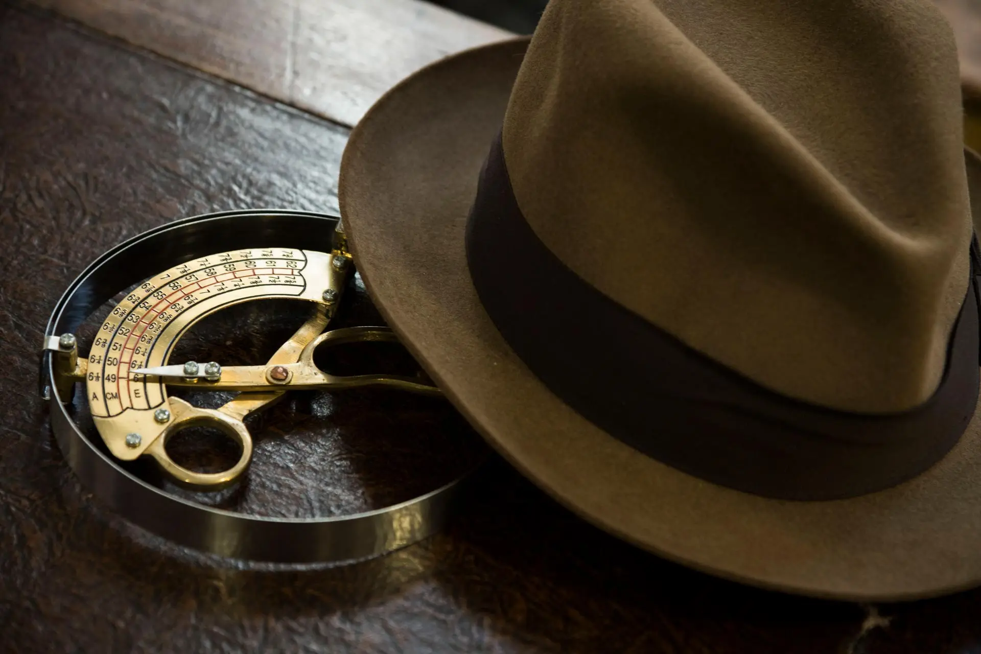 A felt hat on the hat measuring tool